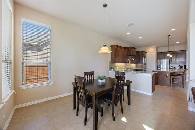 211 Crestbrook Dr, Rockwall, TX 75087 - dining area featuring recessed lighting, light tile patterned floors, and baseboards