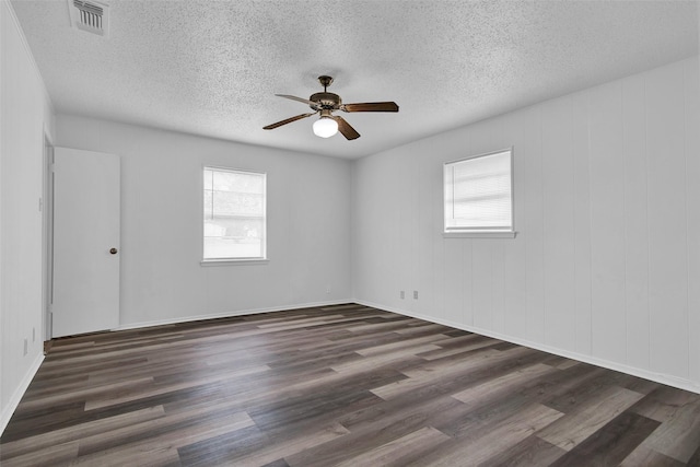 412 Lee Blvd, Pottsboro, TX 75076 - unfurnished room with plenty of natural light, a ceiling fan, a textured ceiling, and wood finished floors