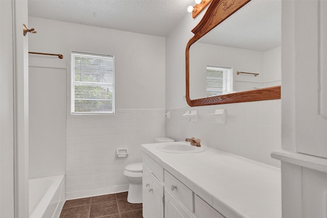 412 Lee Blvd, Pottsboro, TX 75076 - bathroom with toilet, tile patterned flooring, vanity, wainscoting, and tile walls
