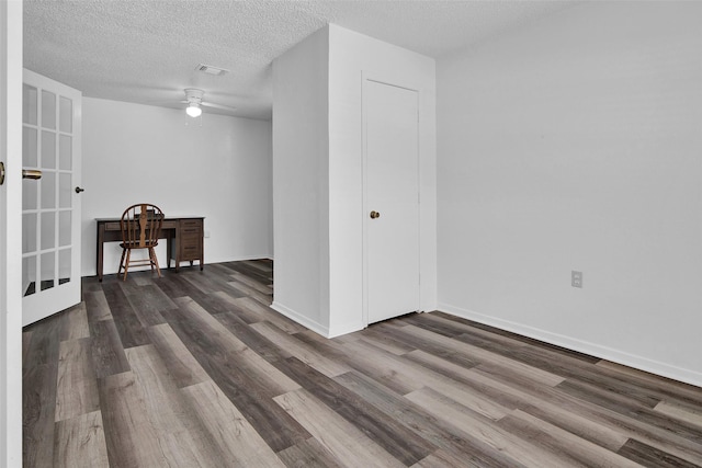 412 Lee Blvd, Pottsboro, TX 75076 - spare room featuring ceiling fan, dark wood finished floors, a textured ceiling, baseboards, and french doors