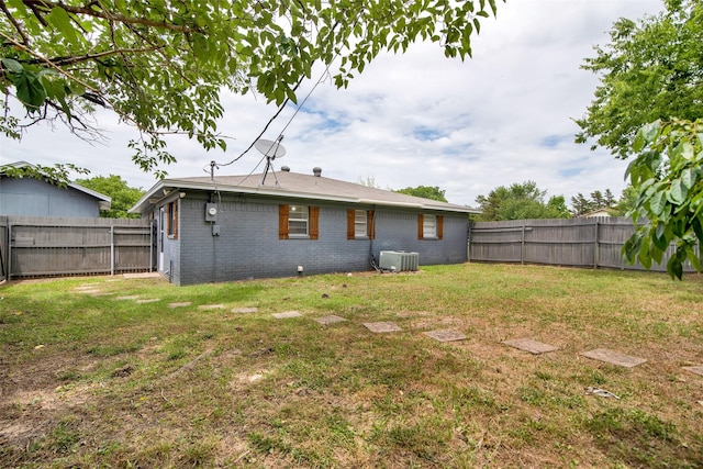 412 Lee Blvd, Pottsboro, TX 75076 - rear view of house with brick siding and central air condition unit