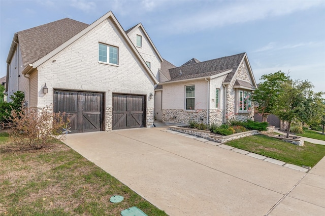 8416 Shoreacres Dr, Mckinney, TX 75070 - view of front facade with a shingled roof, stone siding, and an attached garage
