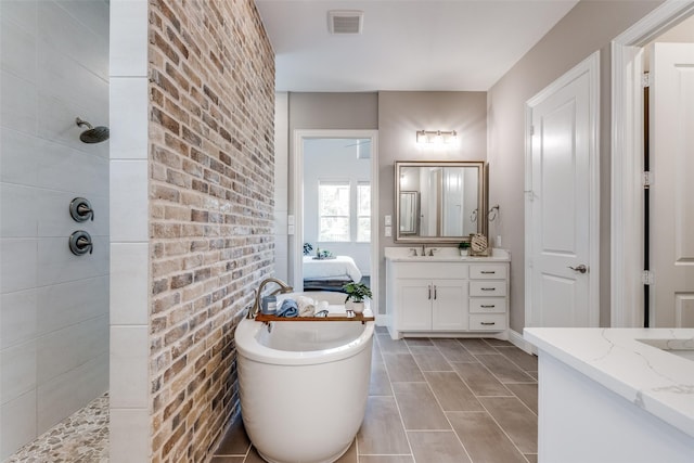 8416 Shoreacres Dr, Mckinney, TX 75070 - bathroom with walk in shower, vanity, a freestanding bath, and ensuite bathroom
