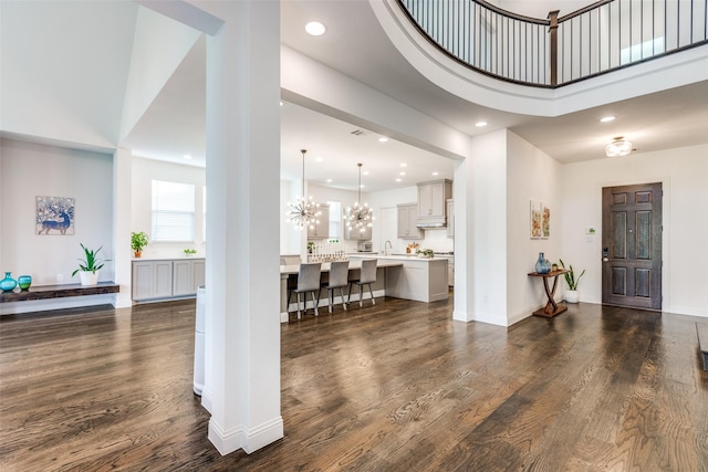 8416 Shoreacres Dr, Mckinney, TX 75070 - entrance foyer with dark wood-style flooring, recessed lighting, a chandelier, and baseboards