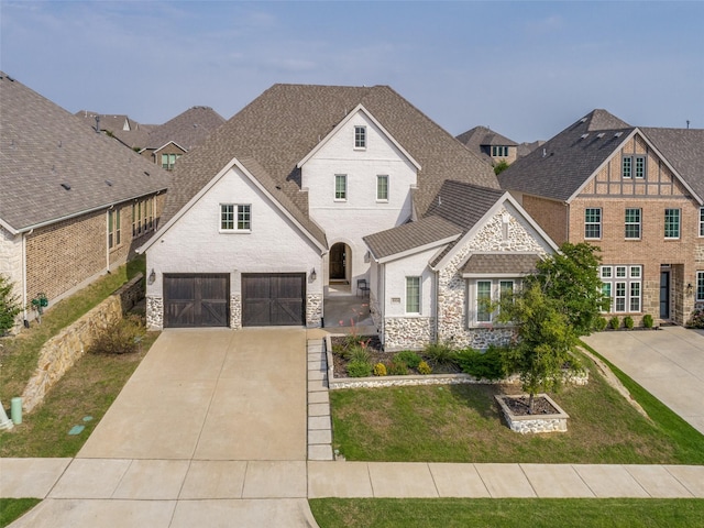 8416 Shoreacres Dr, Mckinney, TX 75070 - view of front facade with stone siding, driveway, roof with shingles, and a front yard