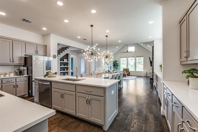 8416 Shoreacres Dr, Mckinney, TX 75070 - kitchen with gray cabinets, dishwashing machine, a sink, open floor plan, and dark wood-style flooring