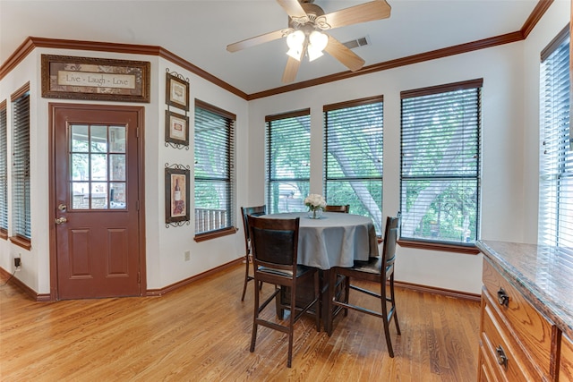 4402 Running Brook Dr, Rowlett, TX 75088 - dining space featuring baseboards, light wood-style flooring, ornamental molding, and a ceiling fan