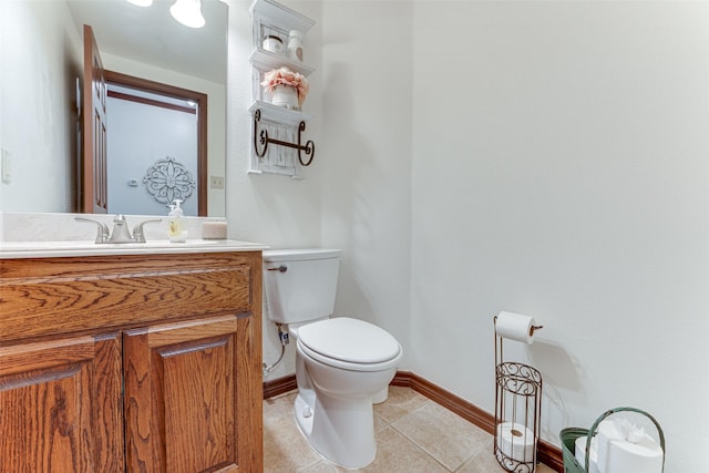 4402 Running Brook Dr, Rowlett, TX 75088 - half bathroom with baseboards, toilet, vanity, and tile patterned flooring