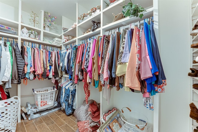 4402 Running Brook Dr, Rowlett, TX 75088 - walk in closet with wood finished floors