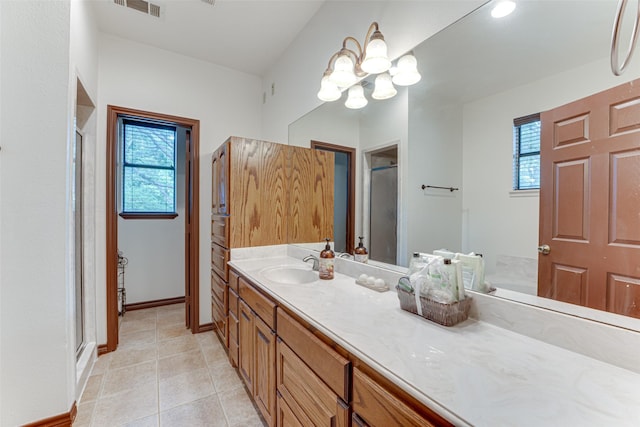4402 Running Brook Dr, Rowlett, TX 75088 - full bath featuring a shower stall, vanity, a chandelier, tile patterned floors, and baseboards