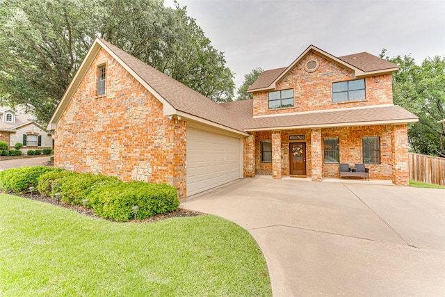 4402 Running Brook Dr, Rowlett, TX 75088 - traditional-style house with concrete driveway, a garage, roof with shingles, a porch, and brick siding