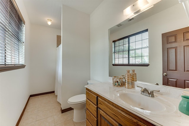 4402 Running Brook Dr, Rowlett, TX 75088 - bathroom featuring plenty of natural light, toilet, tile patterned floors, and vanity