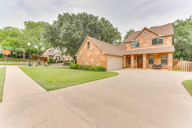 4402 Running Brook Dr, Rowlett, TX 75088 - view of front of home with driveway, brick siding, a shingled roof, covered porch, and a garage