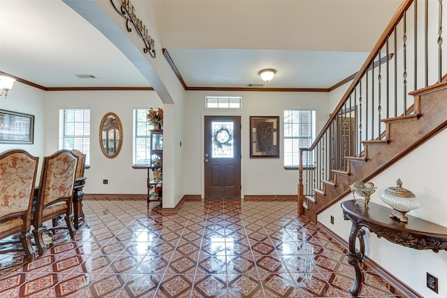 4402 Running Brook Dr, Rowlett, TX 75088 - foyer with baseboards, arched walkways, ornamental molding, stairs, and a chandelier
