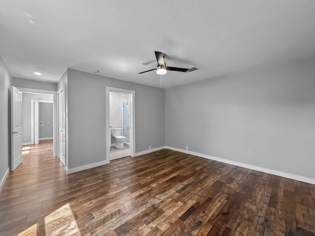1209 N Morris St, Gainesville, TX 76240 - unfurnished bedroom featuring wood finished floors, baseboards, ensuite bath, a ceiling fan, and recessed lighting