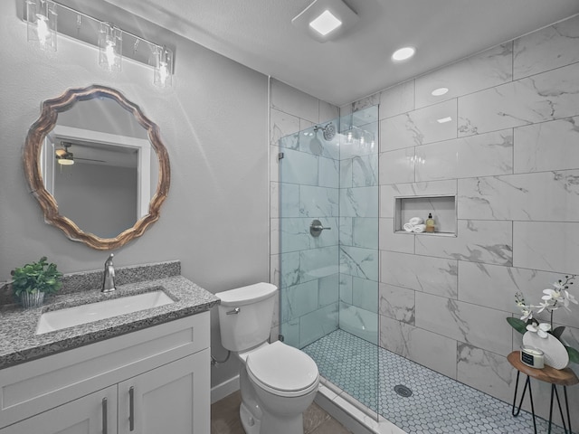 1209 N Morris St, Gainesville, TX 76240 - full bathroom with walk in shower, toilet, vanity, and a ceiling fan