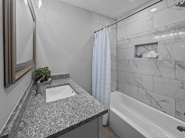 1209 N Morris St, Gainesville, TX 76240 - bathroom featuring vanity and shower / tub combo with curtain