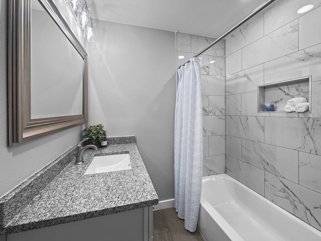 1209 N Morris St, Gainesville, TX 76240 - bathroom featuring shower / tub combo and vanity