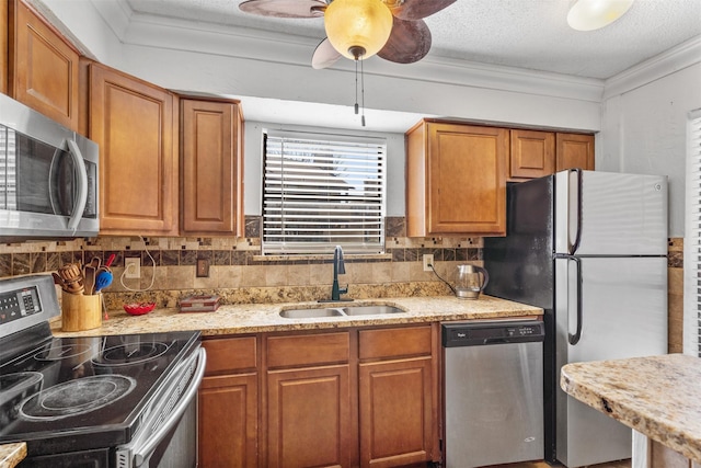1104 Harwell Dr Unit 1514, Arlington, TX 76011 - kitchen featuring appliances with stainless steel finishes, a sink, brown cabinets, backsplash, and ornamental molding