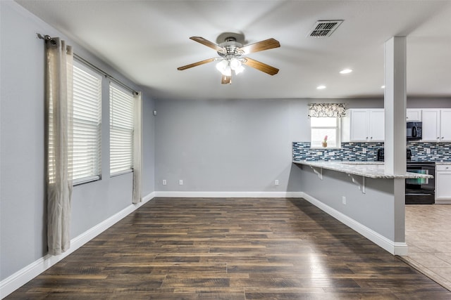 12748 Gillon Dr, Frisco, TX 75035 - unfurnished living room featuring a ceiling fan, recessed lighting, wood finished floors, and baseboards