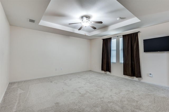 12748 Gillon Dr, Frisco, TX 75035 - carpeted empty room featuring a tray ceiling, a ceiling fan, and baseboards