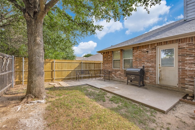 12748 Gillon Dr, Frisco, TX 75035 - fenced backyard featuring a patio