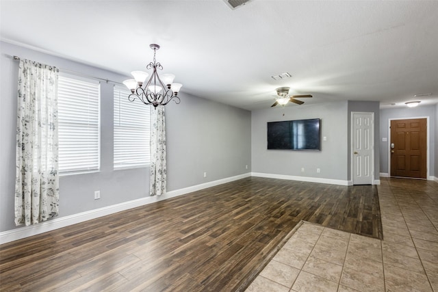 12748 Gillon Dr, Frisco, TX 75035 - unfurnished living room with wood finished floors, a ceiling fan, a chandelier, and baseboards