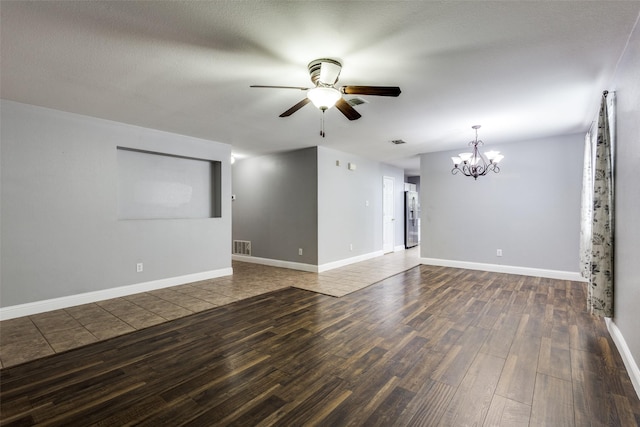 12748 Gillon Dr, Frisco, TX 75035 - unfurnished living room with a chandelier, ceiling fan, wood finished floors, and baseboards