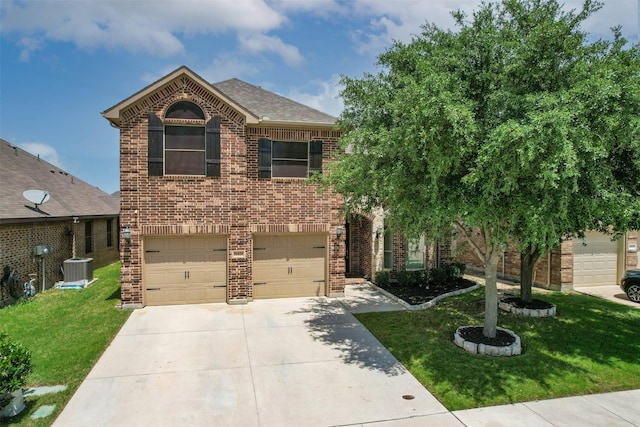 11424 Grapeleaf Dr, Fort Worth, TX 76244 - view of front of home with an attached garage, driveway, brick siding, and a front yard