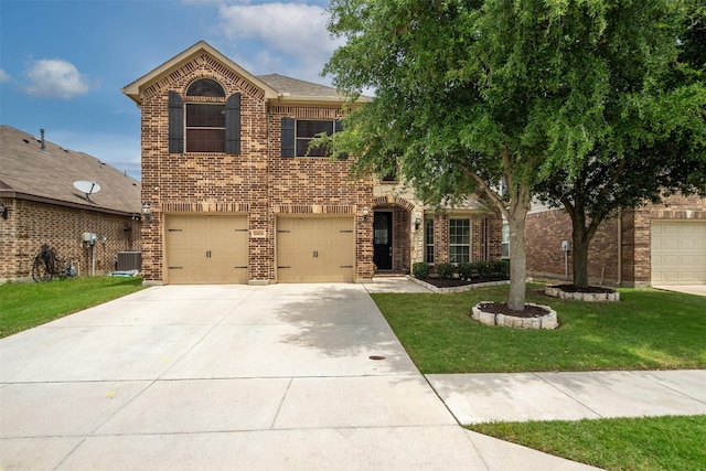 11424 Grapeleaf Dr, Fort Worth, TX 76244 - view of front of home with concrete driveway, a front yard, brick siding, and an attached garage