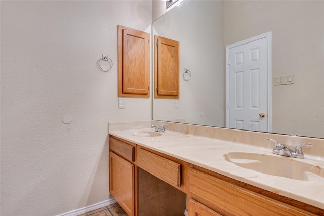 2009 Briargate Ln, Mesquite, TX 75181 - bathroom with double vanity and baseboards