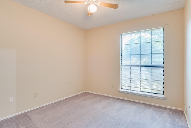 2009 Briargate Ln, Mesquite, TX 75181 - unfurnished room featuring a ceiling fan, carpet floors, baseboards, and a textured ceiling
