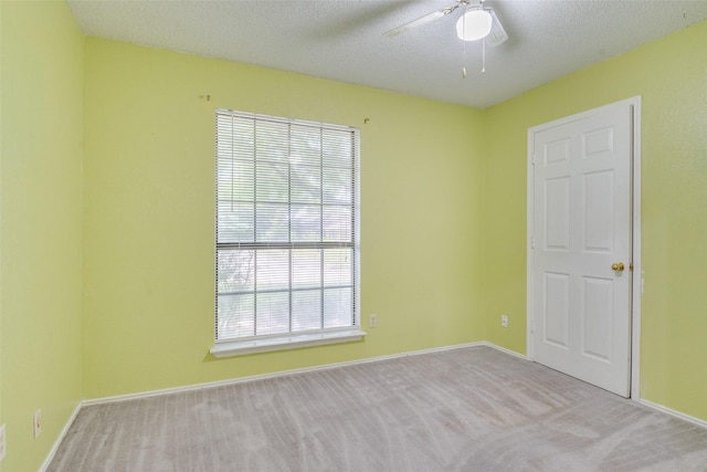 2009 Briargate Ln, Mesquite, TX 75181 - spare room featuring carpet flooring, a ceiling fan, baseboards, and a textured ceiling