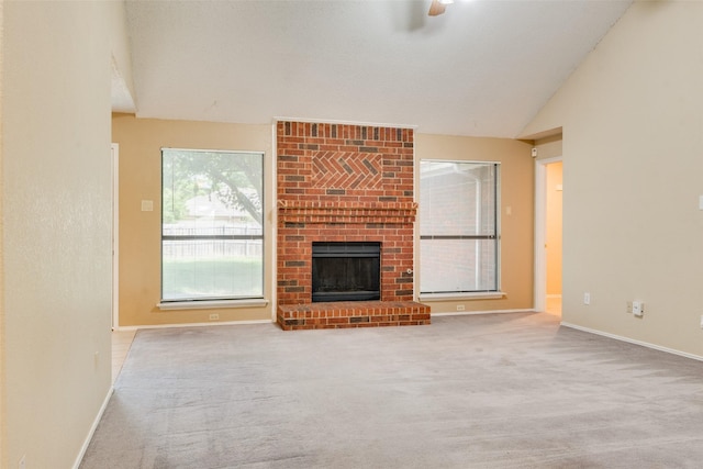 2009 Briargate Ln, Mesquite, TX 75181 - unfurnished living room with carpet floors, baseboards, lofted ceiling, and a brick fireplace