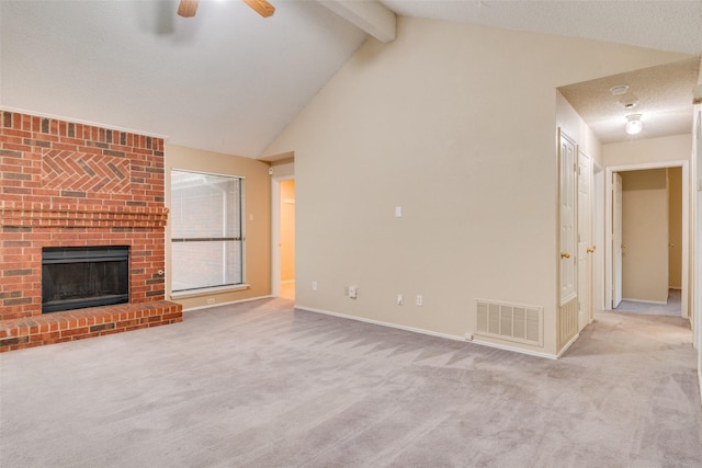 2009 Briargate Ln, Mesquite, TX 75181 - unfurnished living room featuring carpet flooring, ceiling fan, beam ceiling, a brick fireplace, and baseboards