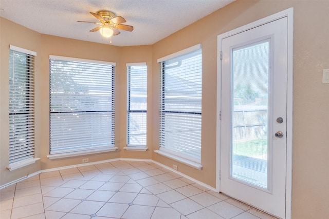 2009 Briargate Ln, Mesquite, TX 75181 - entryway featuring healthy amount of natural light, a ceiling fan, and light tile patterned floors