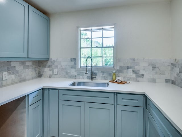 1104 Cortez St, Denison, TX 75020 - kitchen featuring a sink, decorative backsplash, and light countertops