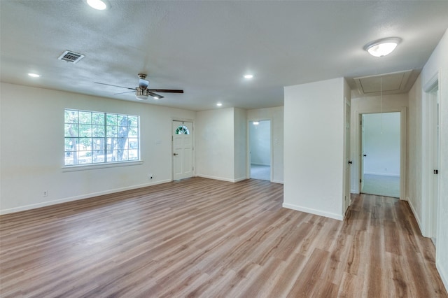 1104 Cortez St, Denison, TX 75020 - unfurnished living room featuring attic access, light wood-type flooring, baseboards, ceiling fan, and recessed lighting