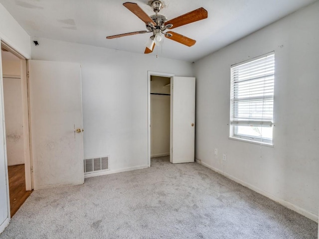 2203 Gould Ave, Fort Worth, TX 76164 - unfurnished bedroom featuring carpet flooring, a closet, ceiling fan, and baseboards
