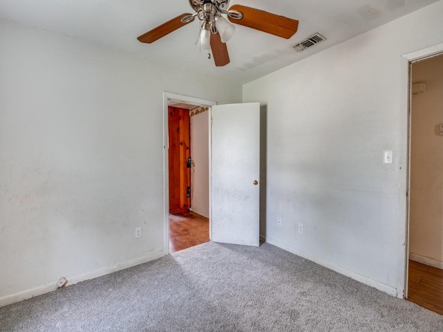 2203 Gould Ave, Fort Worth, TX 76164 - spare room featuring a ceiling fan, carpet, and baseboards