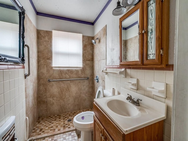 2203 Gould Ave, Fort Worth, TX 76164 - bathroom featuring tile walls, a shower stall, toilet, vanity, and ornamental molding