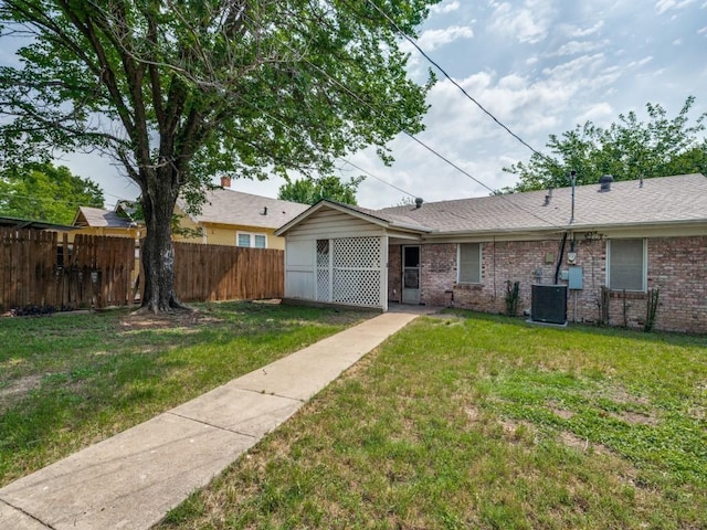 2203 Gould Ave, Fort Worth, TX 76164 - back of house with central AC and brick siding