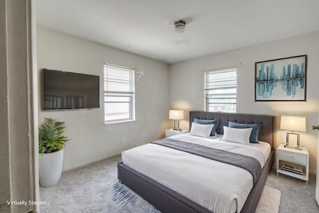 2203 Gould Ave, Fort Worth, TX 76164 - bedroom featuring carpet, multiple windows, and baseboards