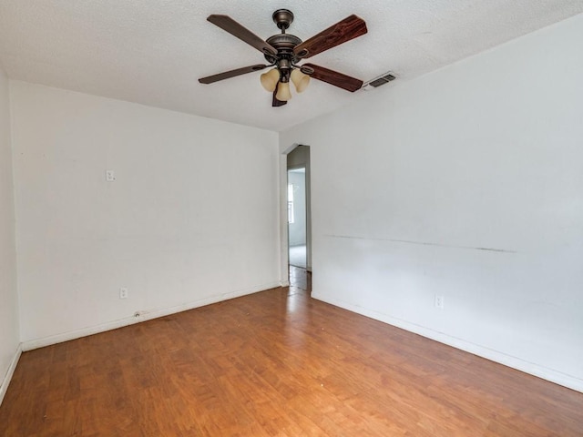 2203 Gould Ave, Fort Worth, TX 76164 - empty room featuring wood finished floors, a ceiling fan, and baseboards