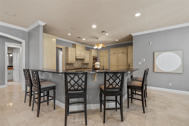 6021 Canyon Trl, Waco, TX 76657 - kitchen with ceiling fan, recessed lighting, dark countertops, ornamental molding, and baseboards