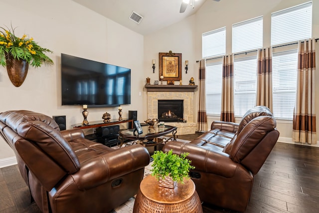 4302 Meadow Hawk Dr, Arlington, TX 76005 - living room featuring a ceiling fan, wood-type flooring, a stone fireplace, plenty of natural light, and high vaulted ceiling