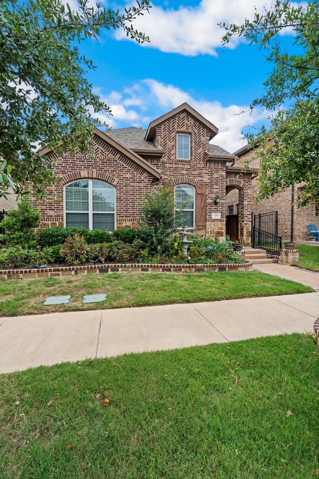 4302 Meadow Hawk Dr, Arlington, TX 76005 - view of front of house featuring brick siding, a front lawn, and a shingled roof