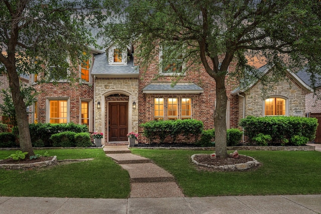 4651 Liam Dr, Frisco, TX 75034 - view of front of property featuring a front yard, stone siding, and brick siding