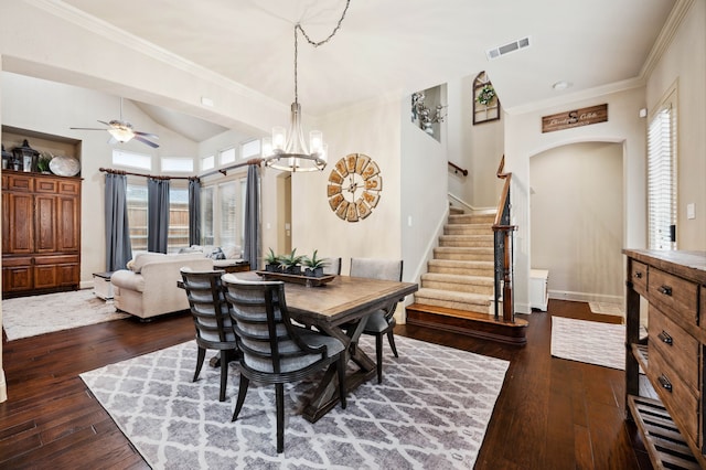 4651 Liam Dr, Frisco, TX 75034 - dining area featuring stairs, dark wood-style floors, arched walkways, ceiling fan, and lofted ceiling