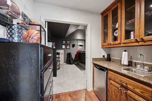 4651 Liam Dr, Frisco, TX 75034 - kitchen with a sink, brown cabinets, dishwasher, and wood finished floors